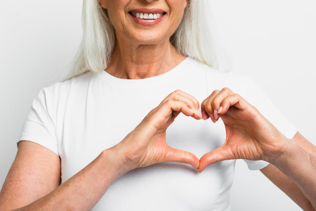 woman making a heart with her hands