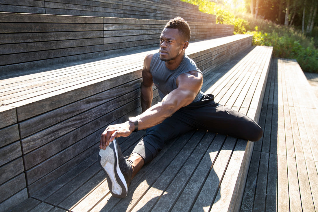 Full shot man stretching outside